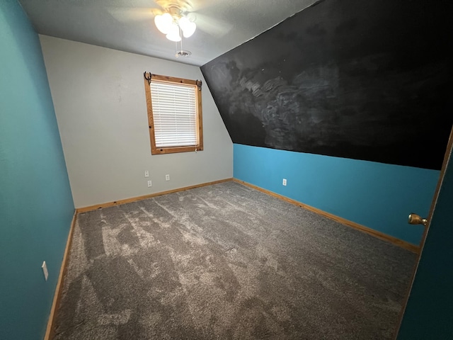 additional living space featuring lofted ceiling, ceiling fan, carpet flooring, and baseboards