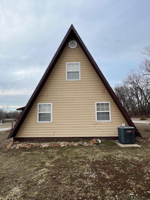 view of side of home featuring central air condition unit