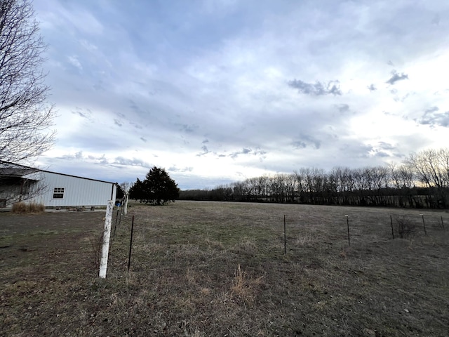 view of yard with a rural view