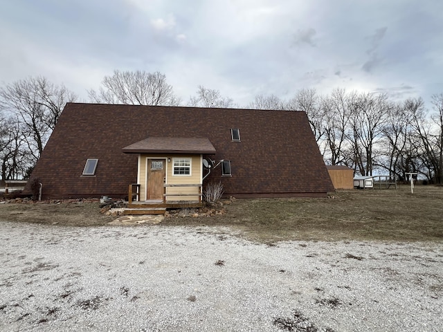 a-frame home with a shingled roof