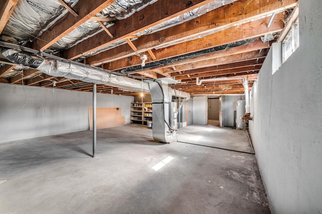 basement with water heater and heating unit