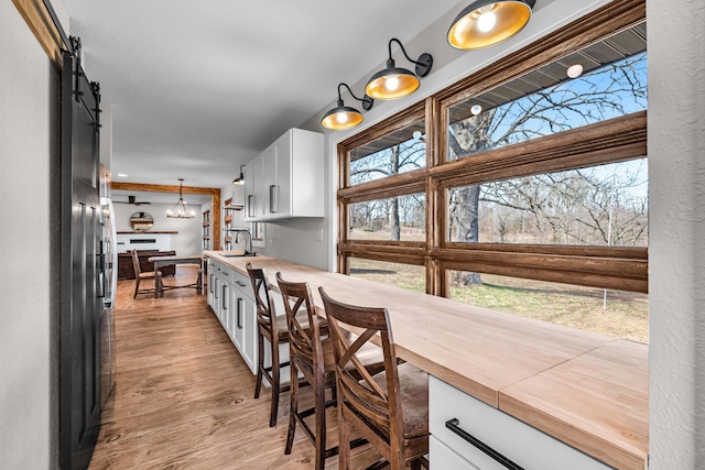 dining room with light wood-type flooring