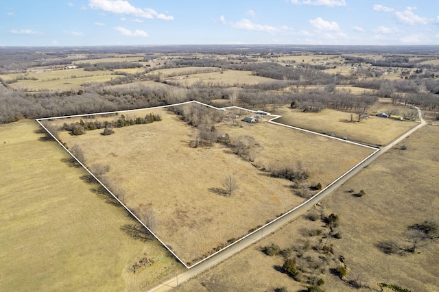 birds eye view of property featuring a rural view