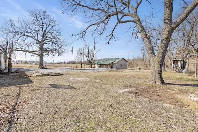 view of yard with a rural view