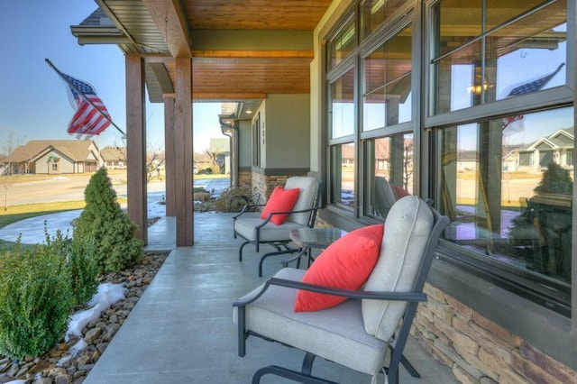 view of patio featuring a residential view and a porch