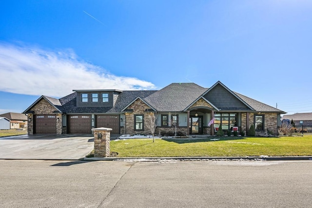 view of front of property featuring a garage, roof with shingles, driveway, and a front lawn