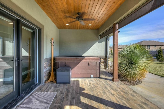 view of patio featuring ceiling fan and a balcony