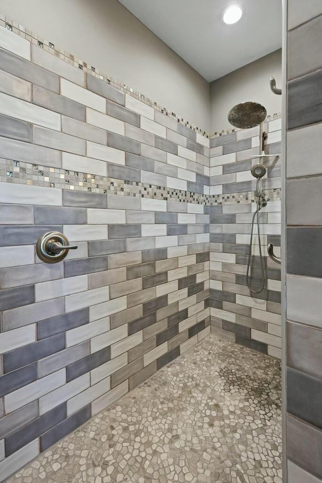 full bathroom with a tile shower