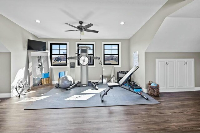 exercise area featuring recessed lighting, wood finished floors, a ceiling fan, and baseboards