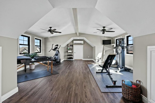 exercise area featuring baseboards, vaulted ceiling, dark wood-type flooring, and a wall mounted AC