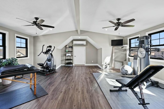 exercise room featuring dark wood-style floors, a wall mounted air conditioner, a wealth of natural light, and baseboards