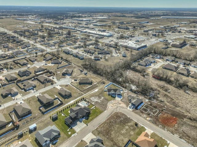 birds eye view of property with a residential view