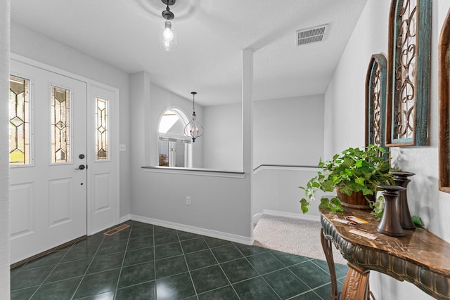 185 Eagle Pointe Dr, Branson, MO 65616 - foyer with dark tile patterned flooring and baseboards
