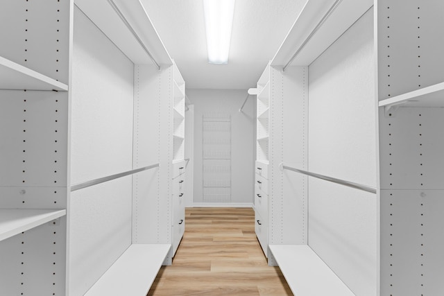 185 Eagle Pointe Dr, Branson, MO 65616 - walk in closet with light wood finished floors