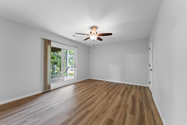 185 Eagle Pointe Dr, Branson, MO 65616 - unfurnished room with a ceiling fan and wood finished floors