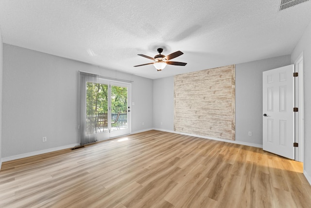 185 Eagle Pointe Dr, Branson, MO 65616 - empty room featuring a ceiling fan, a textured ceiling, and light wood finished floors