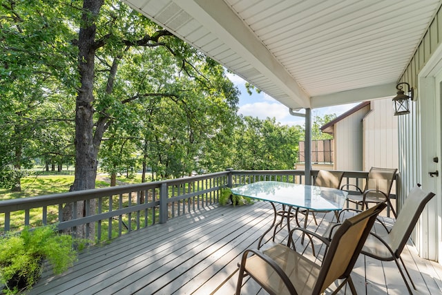 185 Eagle Pointe Dr, Branson, MO 65616 - deck featuring outdoor dining area and view of wooded area