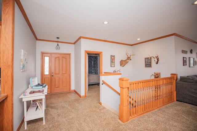 foyer with carpet, baseboards, ornamental molding, and recessed lighting