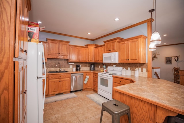 kitchen featuring white appliances, a breakfast bar area, a peninsula, crown molding, and a sink