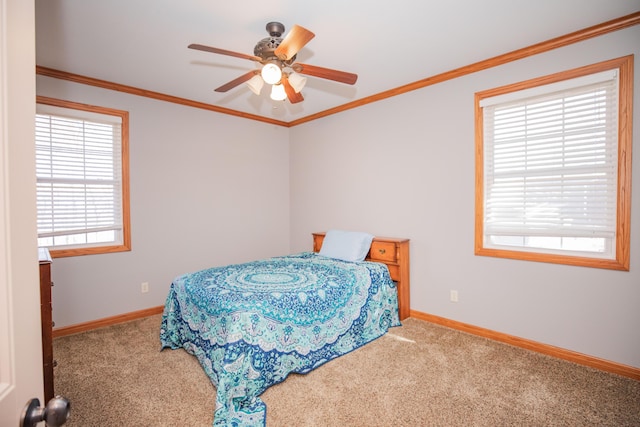 bedroom featuring ornamental molding, carpet flooring, and baseboards