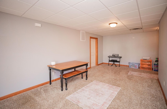 interior space with baseboards, visible vents, and a drop ceiling