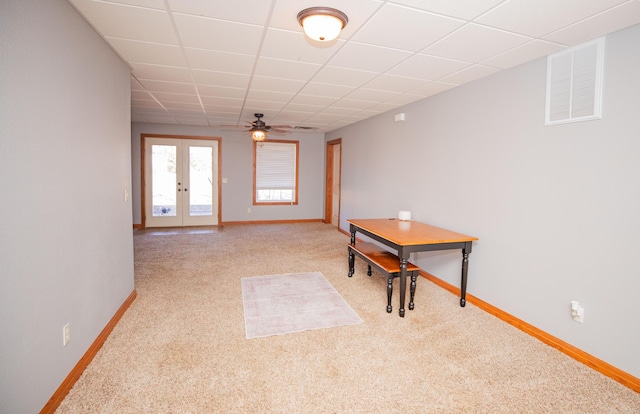 interior space featuring carpet, french doors, visible vents, and a paneled ceiling