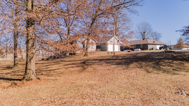 view of yard featuring an attached garage