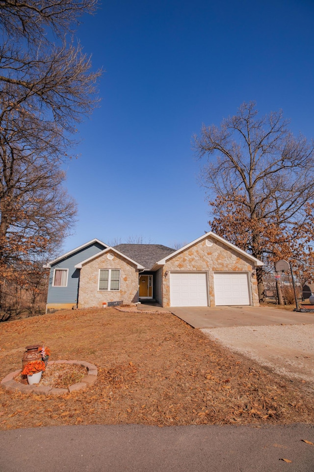 view of front of property with a garage and driveway