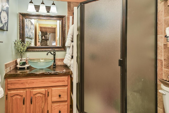 full bath featuring a shower stall and vanity