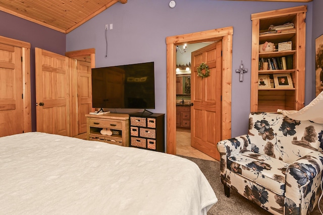 carpeted bedroom featuring connected bathroom, tile patterned flooring, wooden ceiling, and vaulted ceiling