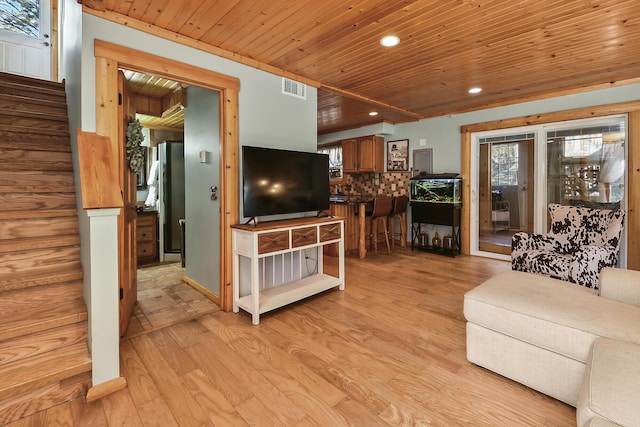 living area featuring wooden ceiling, recessed lighting, visible vents, light wood-style floors, and stairway