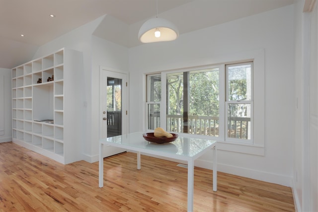 unfurnished dining area with light wood-type flooring, vaulted ceiling, baseboards, and recessed lighting