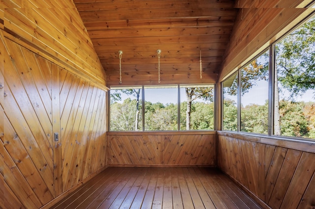 unfurnished sunroom featuring lofted ceiling, a sauna, and plenty of natural light