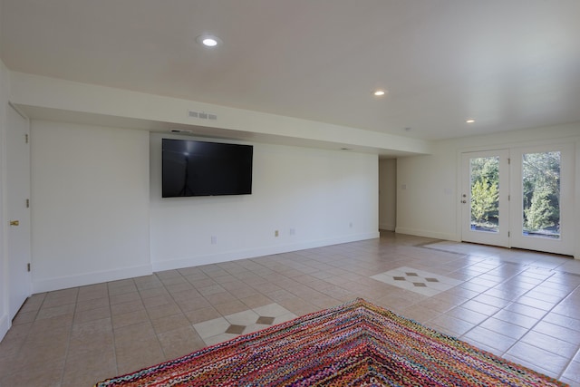 unfurnished living room with recessed lighting, tile patterned flooring, visible vents, and baseboards