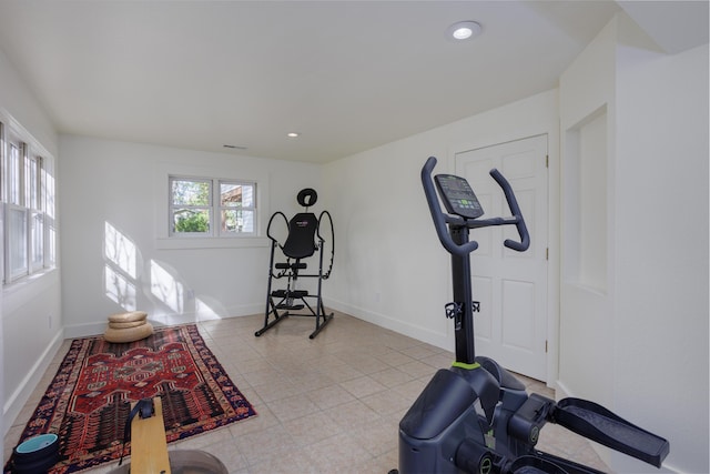 workout area with light tile patterned flooring, baseboards, and recessed lighting