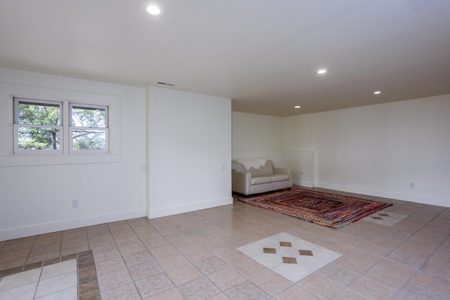 unfurnished room with baseboards, tile patterned floors, visible vents, and recessed lighting