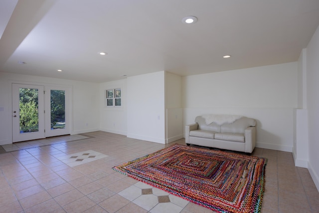 living area featuring recessed lighting, baseboards, and tile patterned floors