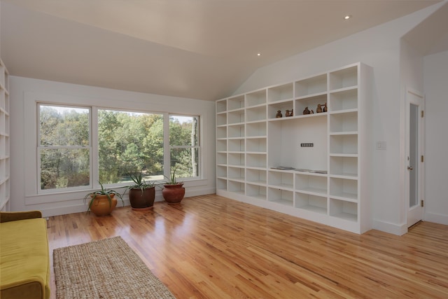 unfurnished room with lofted ceiling, baseboards, recessed lighting, and wood finished floors