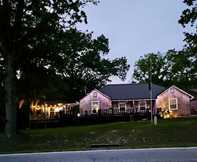 24880 State Highway 413, Galena, MO 65656 - back of house featuring stone siding, a wooden deck, and a yard