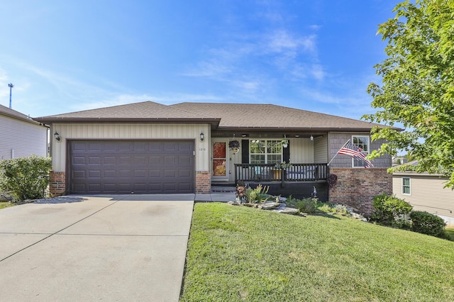 ranch-style home with a garage, brick siding, driveway, and a front lawn