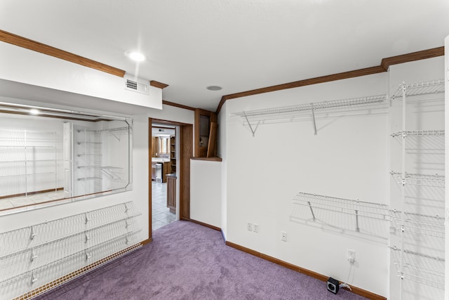 walk in closet featuring carpet floors and visible vents