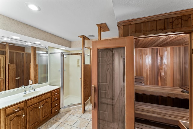 bathroom featuring a stall shower, recessed lighting, vanity, and tile patterned floors