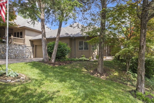 1701 Cedar Ridge Way, Branson West, MO 65737 - view of grassy yard featuring an attached garage and driveway