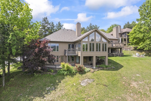 1701 Cedar Ridge Way, Branson West, MO 65737 - back of property with a lawn, a patio, a chimney, roof with shingles, and a deck