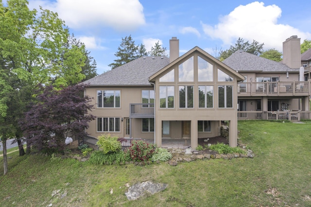 1701 Cedar Ridge Way, Branson West, MO 65737 - back of property featuring a chimney, a lawn, a patio, and roof with shingles