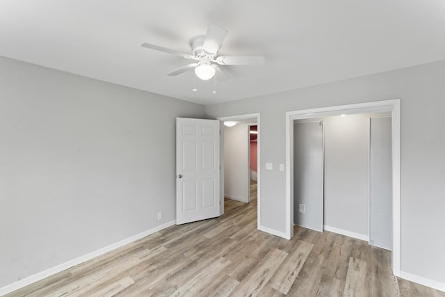 unfurnished bedroom with ceiling fan, a closet, baseboards, and wood finished floors