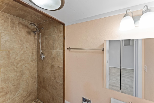 bathroom featuring tiled shower