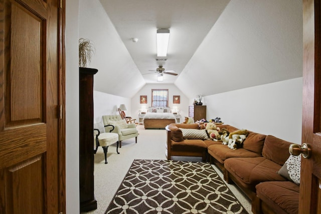 living area featuring lofted ceiling and carpet