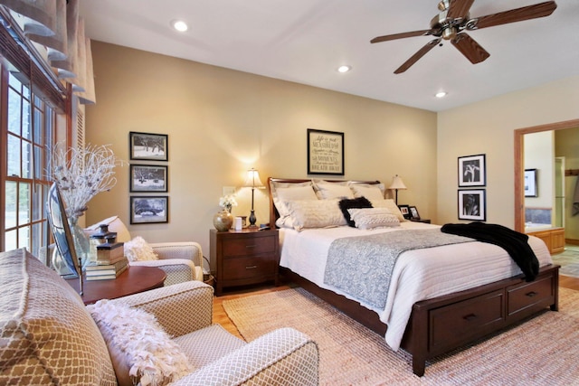 bedroom featuring a ceiling fan, connected bathroom, light wood-style flooring, and recessed lighting