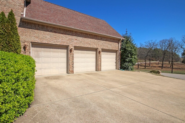 garage featuring driveway